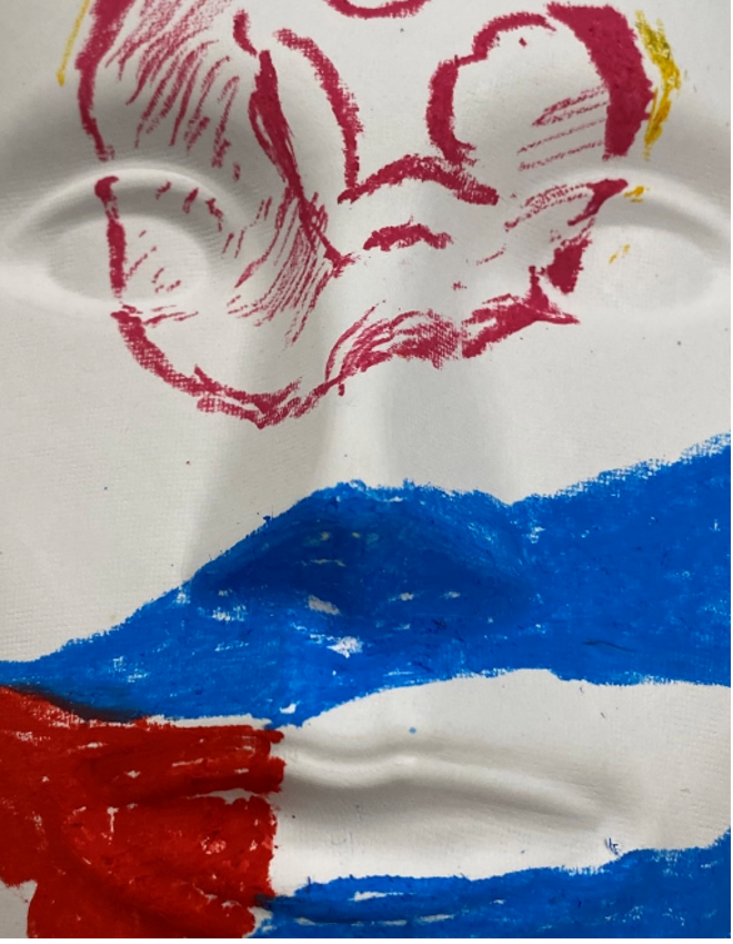 Figure. My mask from Dr Stephen’s workshop shows the Cuban flag, which represents my heritage, and the women’s health symbol, which represents me as a mother and my love for women’s health.