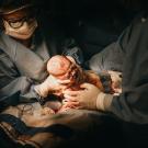 Woman Giving Birth to Baby Via C-section