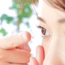 woman using contact lenses