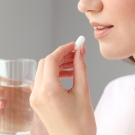 Woman taking a pill