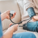 Woman getting blood pressure checked