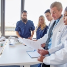 medical team reviewing charts