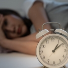 woman struggling with insomnia and chronic pain