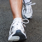 individual running with white shoes