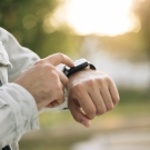 person looking at smart watch