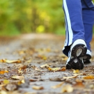 close-up of person's shoes walking outside