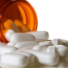 open and spilled bottle of pills