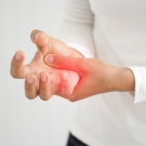 person holding injured hand