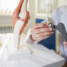 doctor examining a prosthetic joint