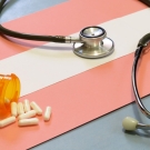 trans flag and stethoscope