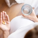 patient holding pills