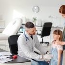 Child with physician 