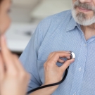 cardiologist using stethoscope