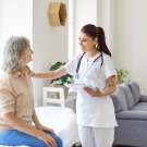 clinician with older female adult patient