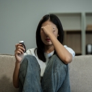 depressed woman holding bottle