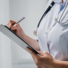 physician with clipboard