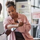 Woman showing doctor her arm 