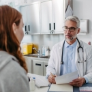 physician talking to a young person