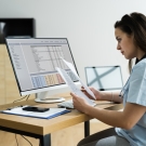 physician looking at data