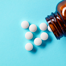 white pills on blue background