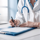 doctor completing chart