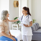 physician talking to woman