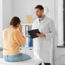 woman meeting doctor about migraine