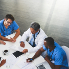 physicians sitting at a table