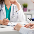physicians looking over chart