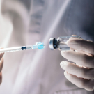 Clinician with needle and vial