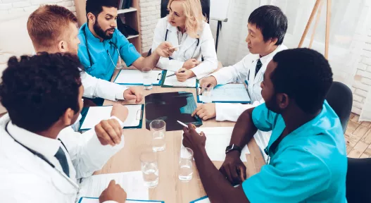 doctors gathered around a table