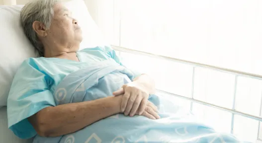 older woman in hospital bed