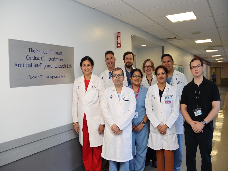 Dr. Annapoorna Kini (left) and her team outside of The Samuel Fineman Cardiac Catheterization Artificial Intelligence Research Lab