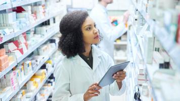 Pharmacist taking inventory