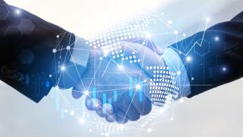 Handshake with digital global world map, network link connection and graph chart of stocks.