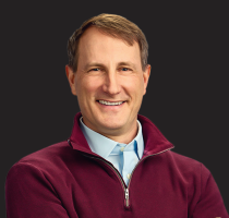 A headshot photograph of Chris Van Denburg.