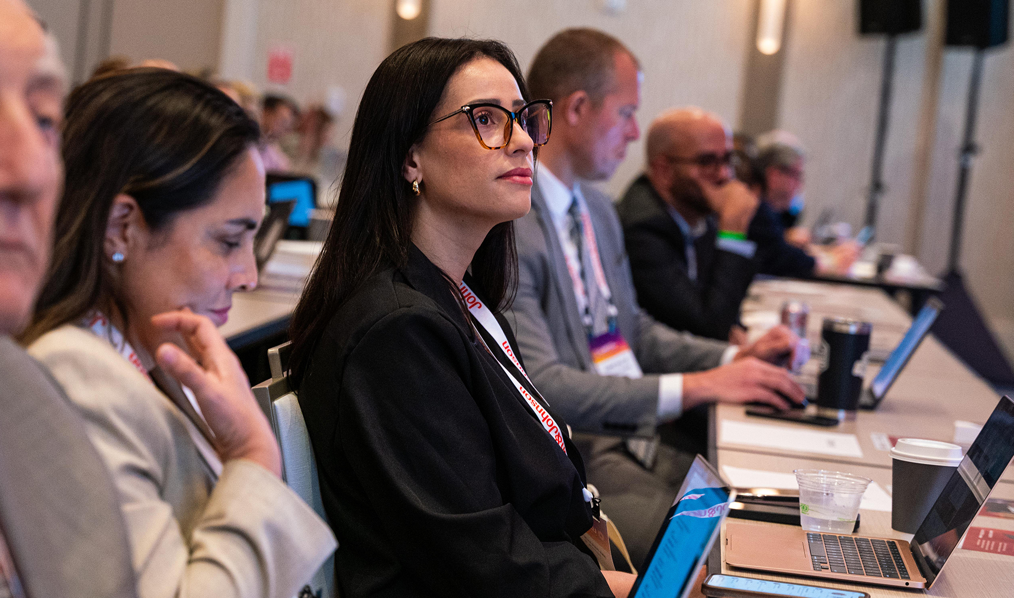 An image of attendees learning in-person at a conference