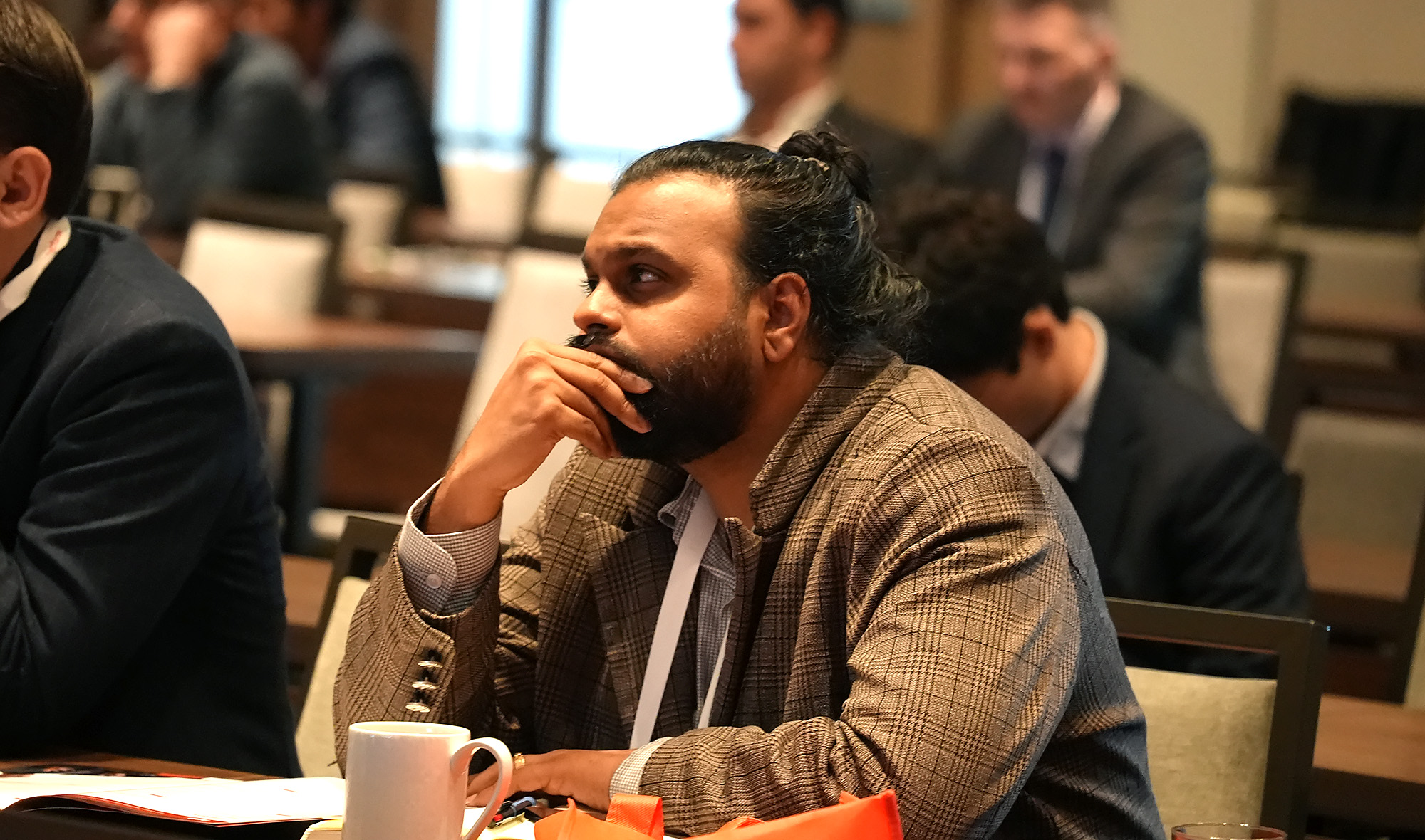 Conference attendee observing session