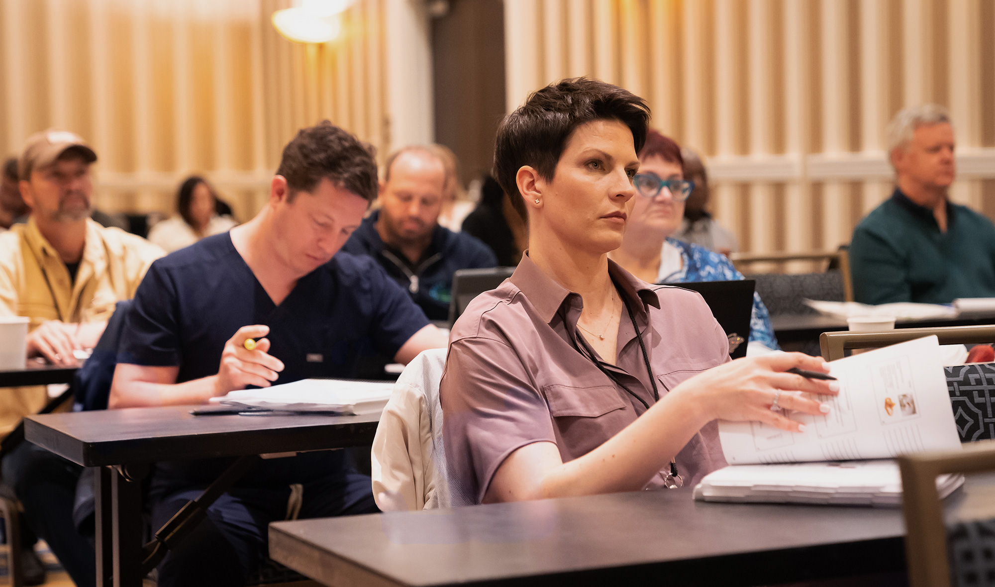 Attendees engaging in an interactive wound care education session at SAWC Spring | WHS.