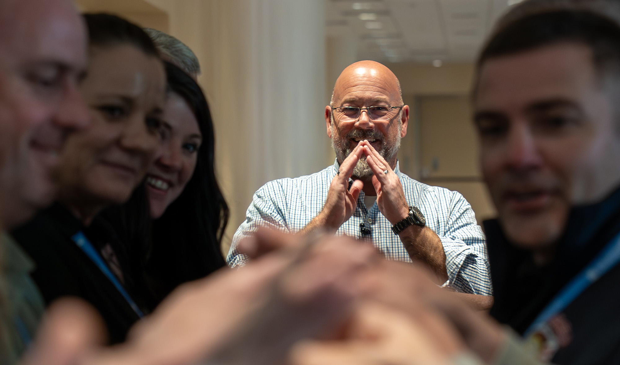 Image of a speaker engaging with attendees during a preconference workshop.