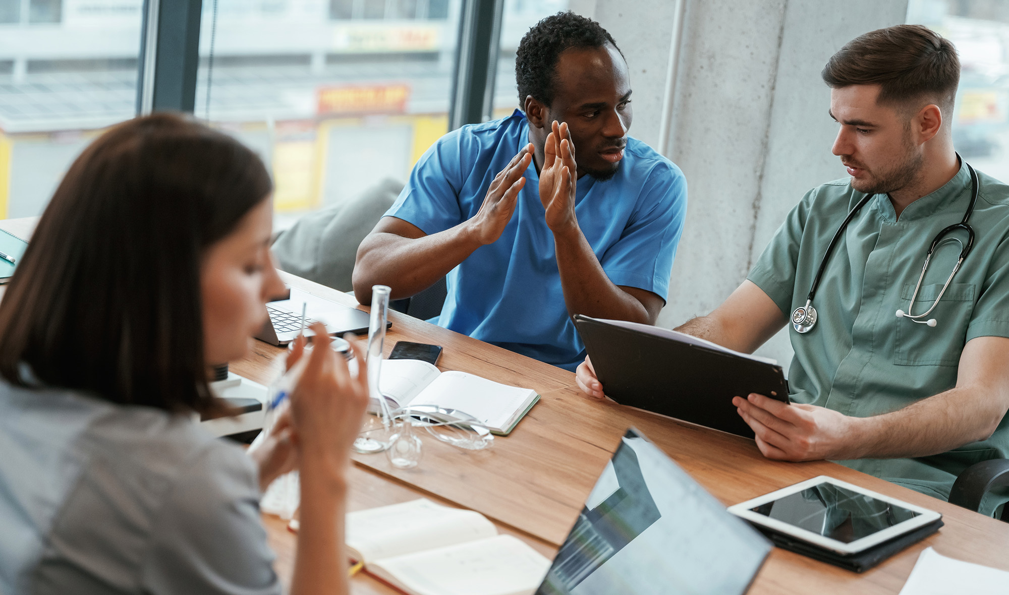 Physicians reviewing patients charts