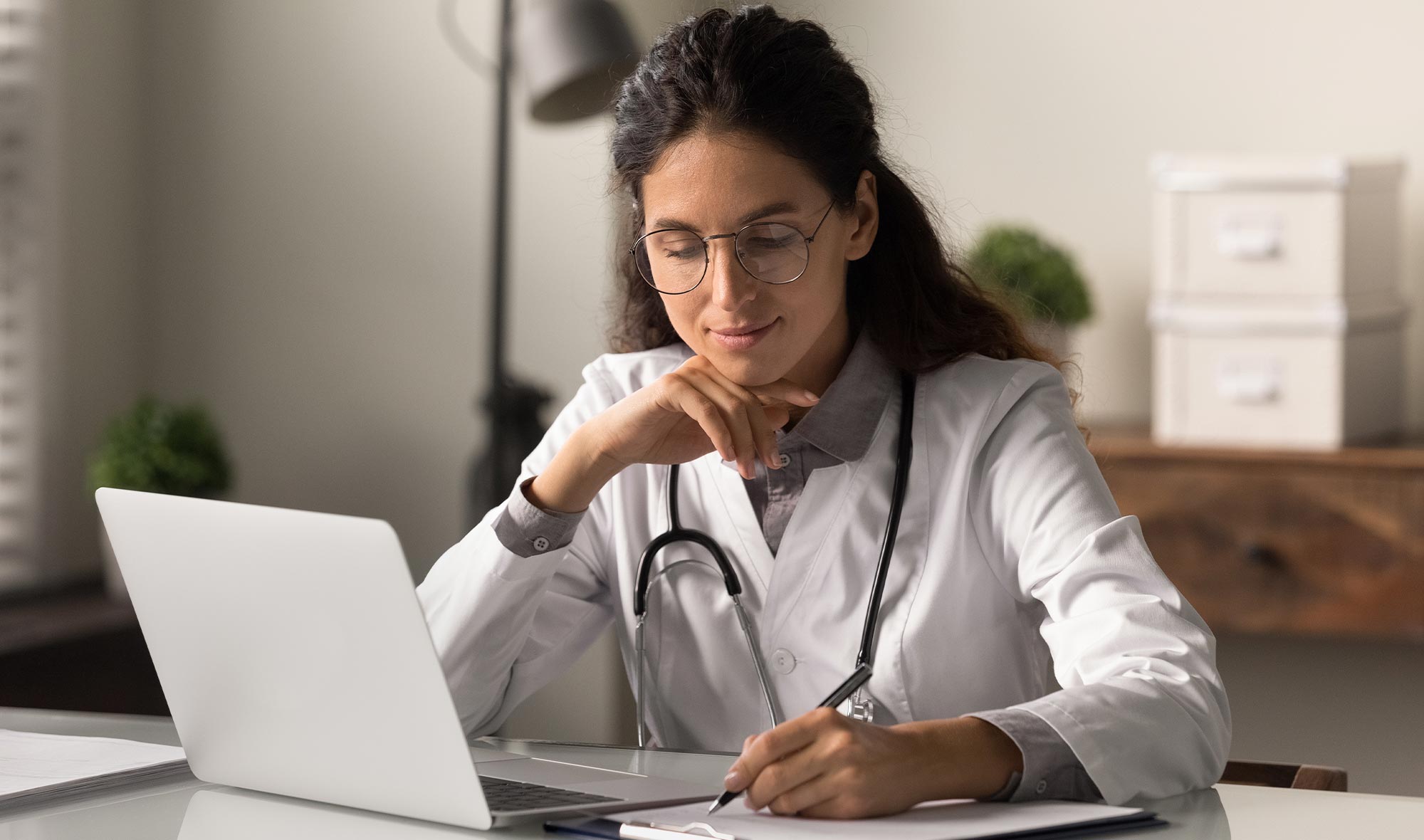 female healthcare professional taking notes