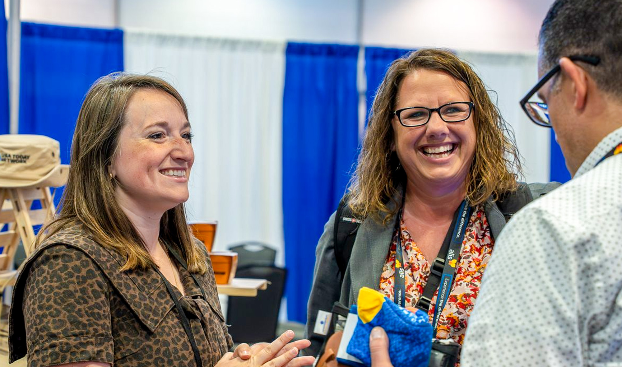 Exhibitors at their booth at SLEC