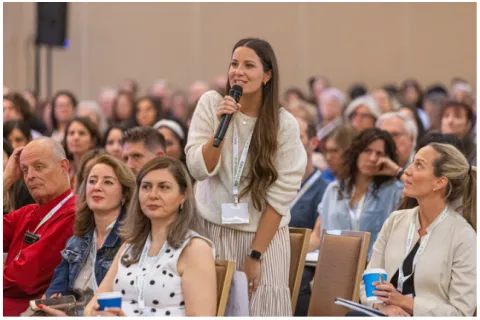 Woman asking question