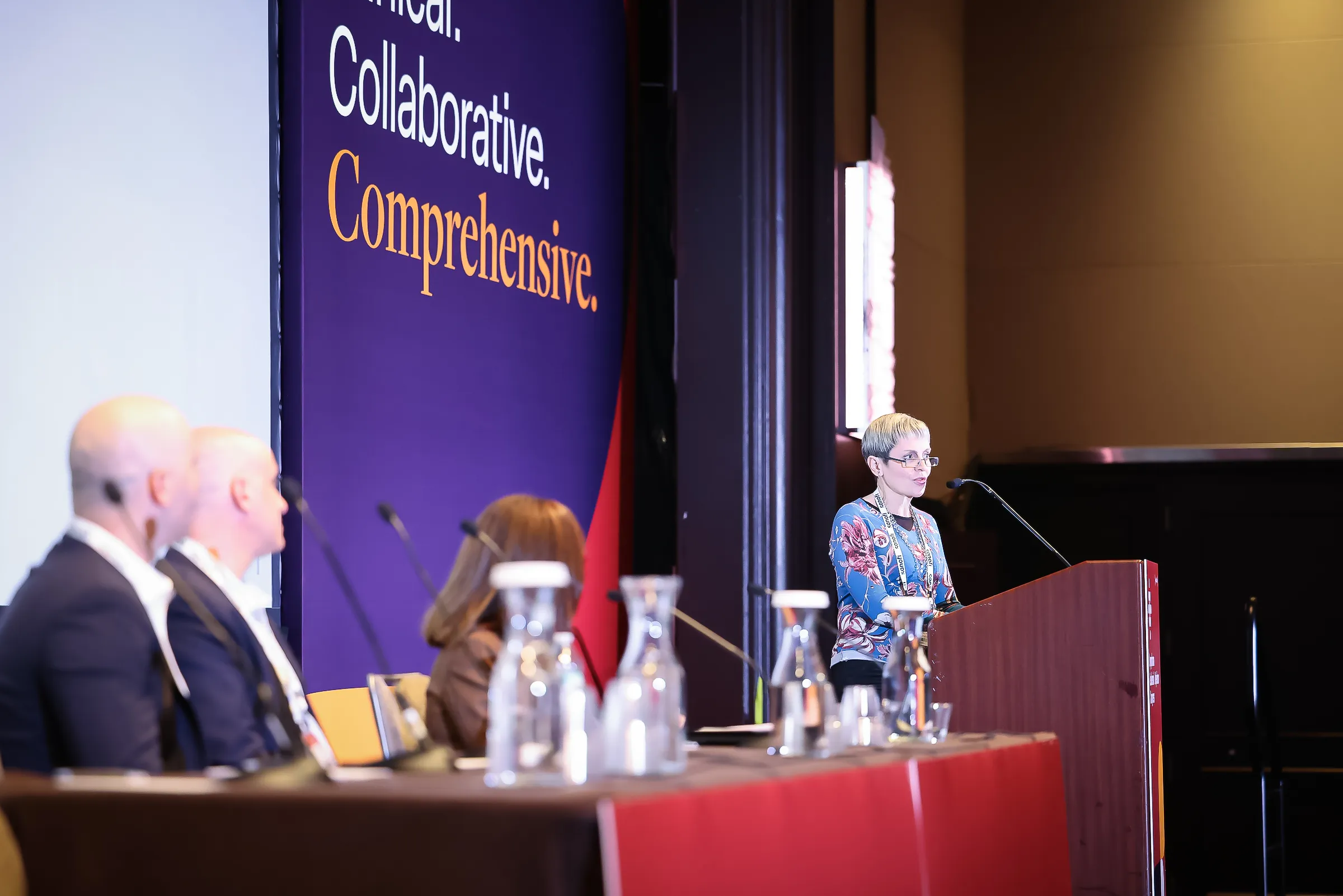 faculty presenting on stage at LL&M Congress