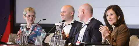 Dr. Roboz and session speakers on stage. 