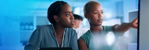 two healthcare practitioners learning on computer