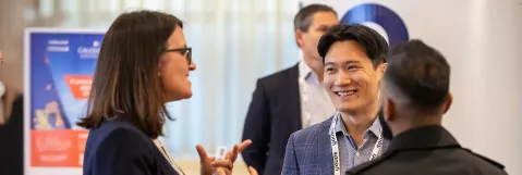 Attendees networking in Exhibit Hall