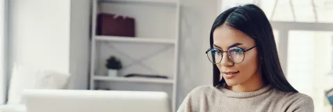 Mental Health Clinician / primary care physician working on a computer