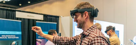 Attendee trying out new technology in exhibit hall